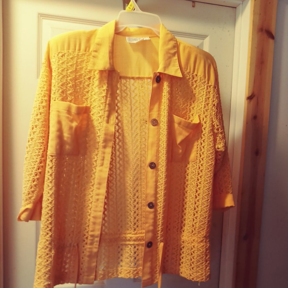 Bright yellow in color large light jacket by Donna Turan